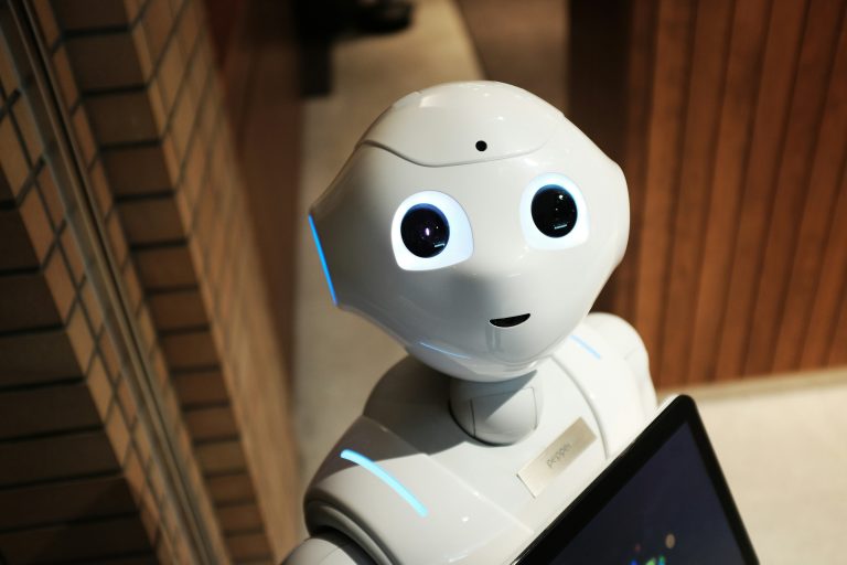 Humanoid robot representing the return of hardware and physical world technology